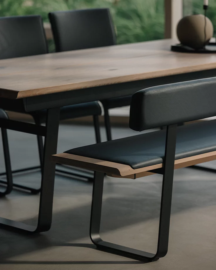 nox dining bench in wild oak white oil with leather backrest and metal sliders in matt black with the nox table and magnum cantilever chairs