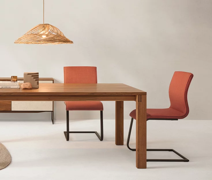 magnum cantilever chairs with Canvas 454 textile cover on sled base in matt black on magnum solid wood table in walnut