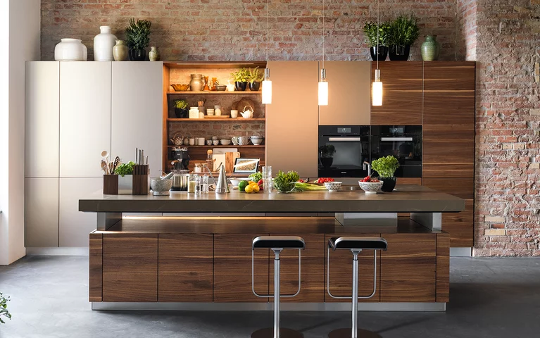 k7 natural wood kitchen in walnut grain throughout with niche and height-adjustable ceramic worktop