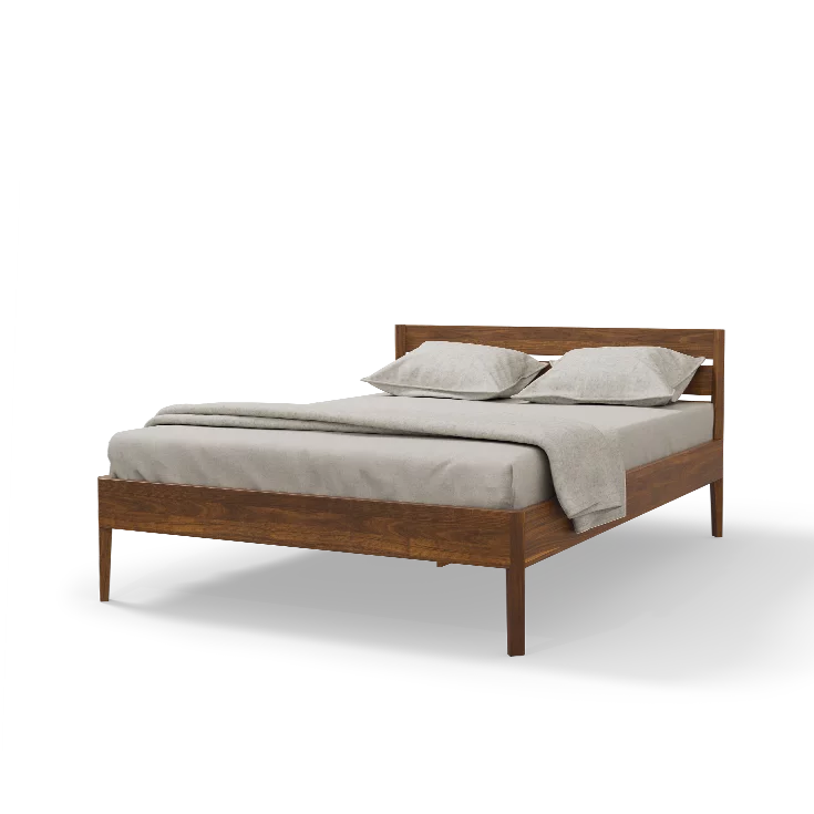 light solid wood bed in walnut with tapered feet