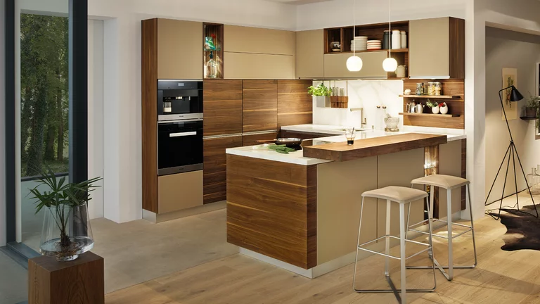 linee real wood kitchen in walnut with quartz stone worktop, coloured glass fronts and bar top with bar stools