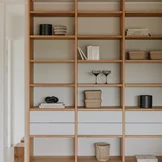modern cubus shelf in solid oak with glass drawers in matt white and touch fittings
