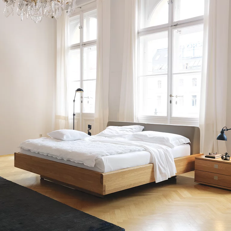 nox bed in solid oak with leather headboard and the nox bedside cabinet