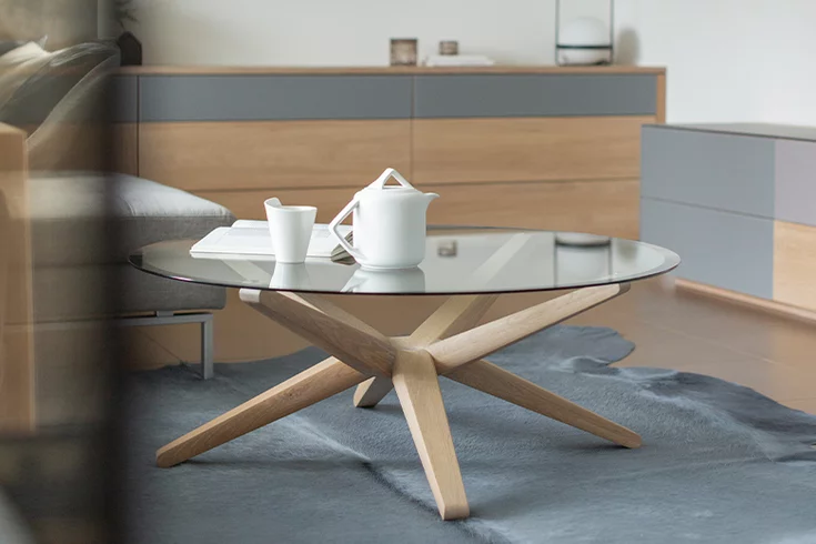 round living room table stern made of solid oak white oil with glass top in modern living room