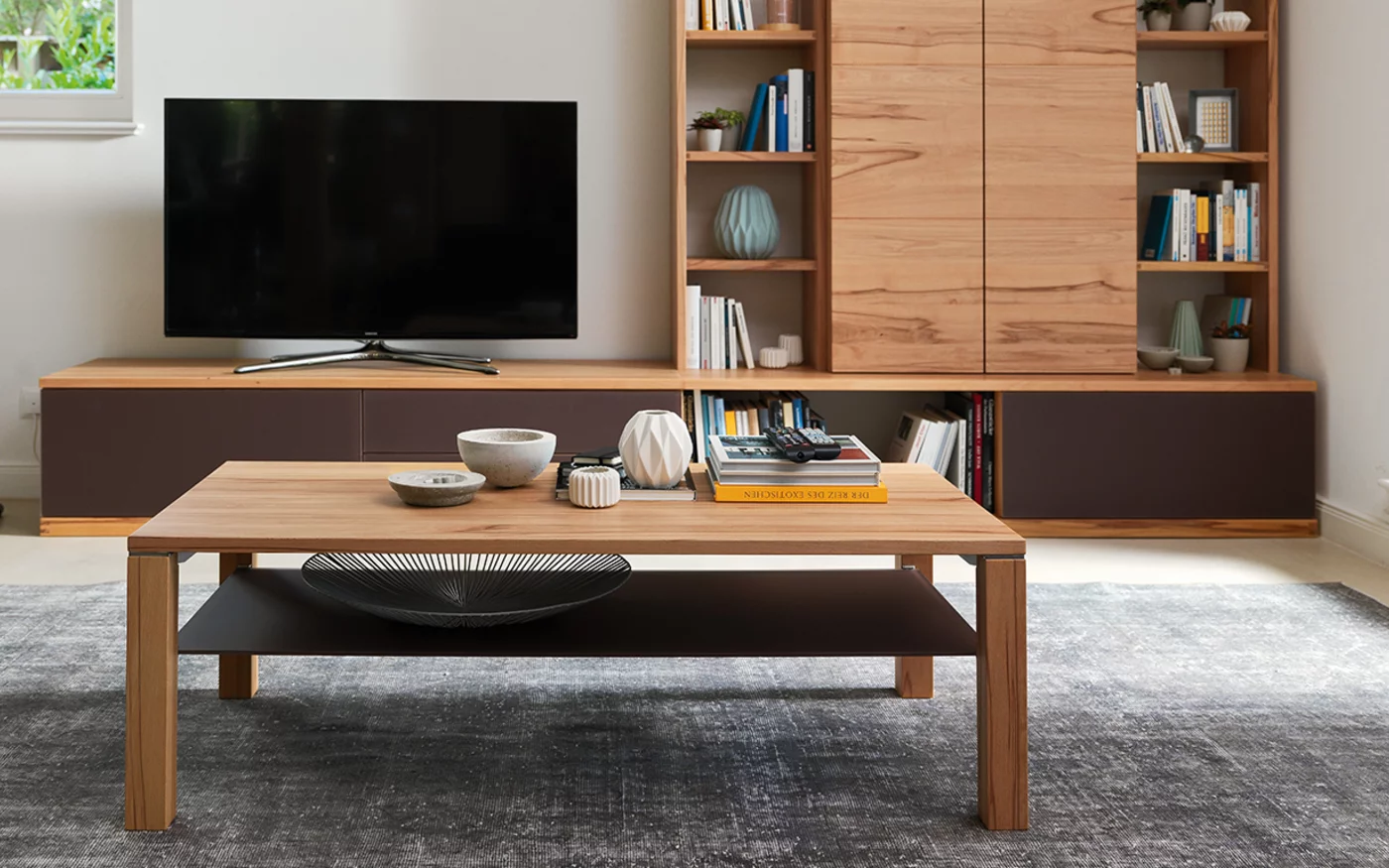 square coffee table cubus made of solid beech heartwood with glass shelf for additional storage space