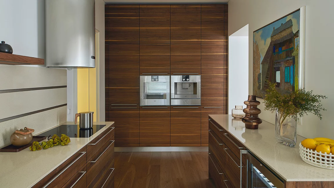 Customised linee solid wood kitchen in walnut, fitted room-high
