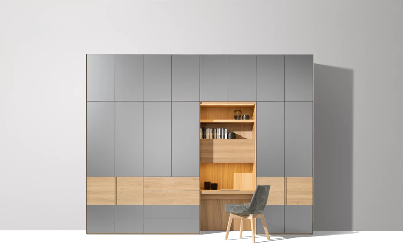 wardrobe with the intermediate unit as home office furniture made of solid oak white oil and coloured glass medium grey matt