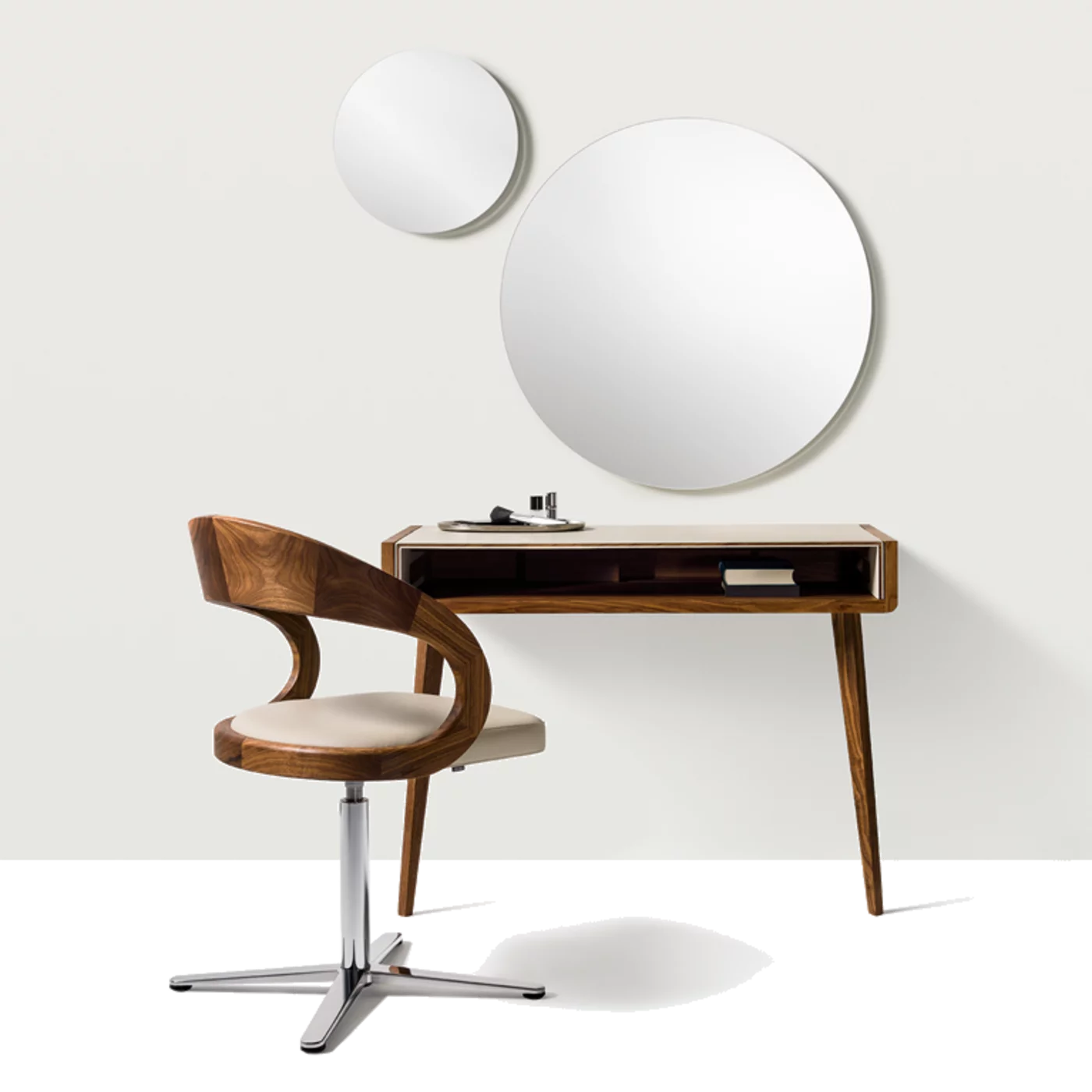 sol solitaire in solid walnut supported by two legs, worktop upholstered in leather and girado chair with base frame