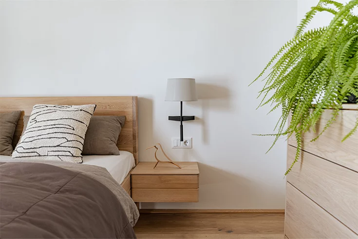 float bed and bedside table next to filigno chest of drawers in white oak oil