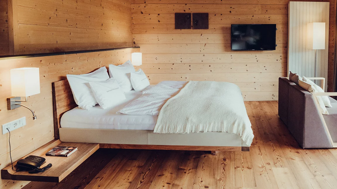 riletto bed with wooden headboard and console in walnut, bed sides with leather cover