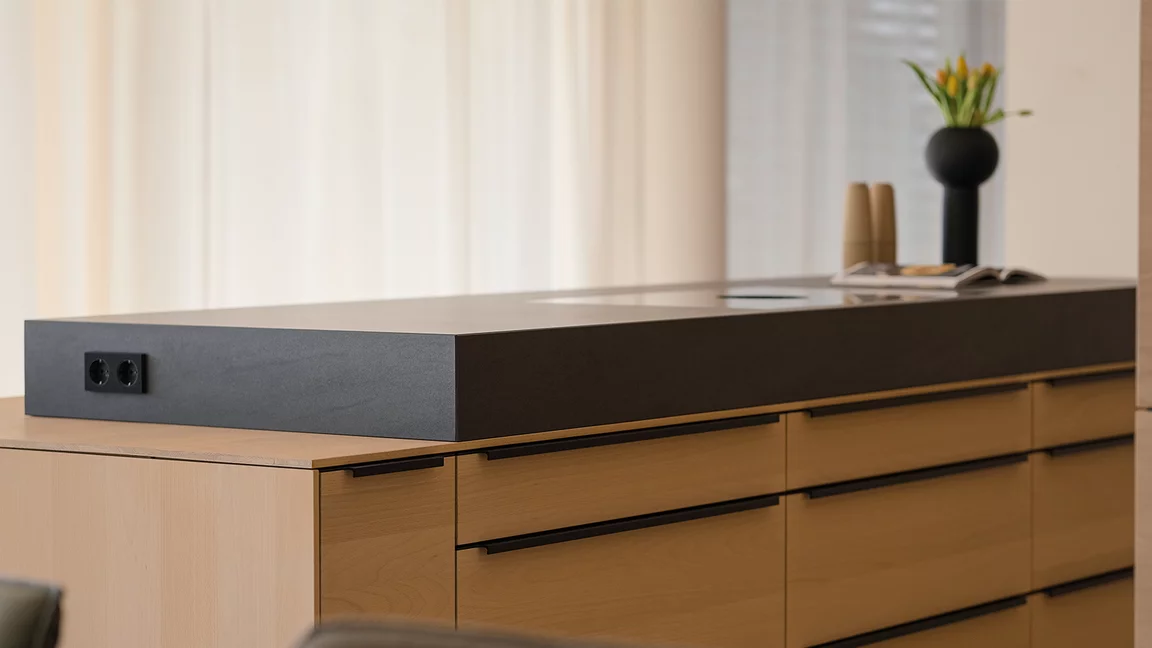 Solid wood cooking island in white beech oil with attached natural stone block