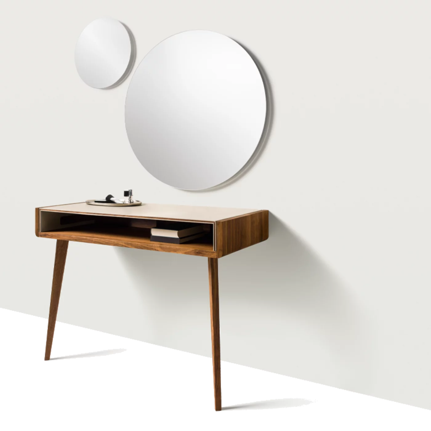 sol solitaire in solid walnut supported by two legs and worktop upholstered in leather