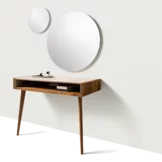 sol solitaire in solid walnut supported by two legs and worktop upholstered in leather