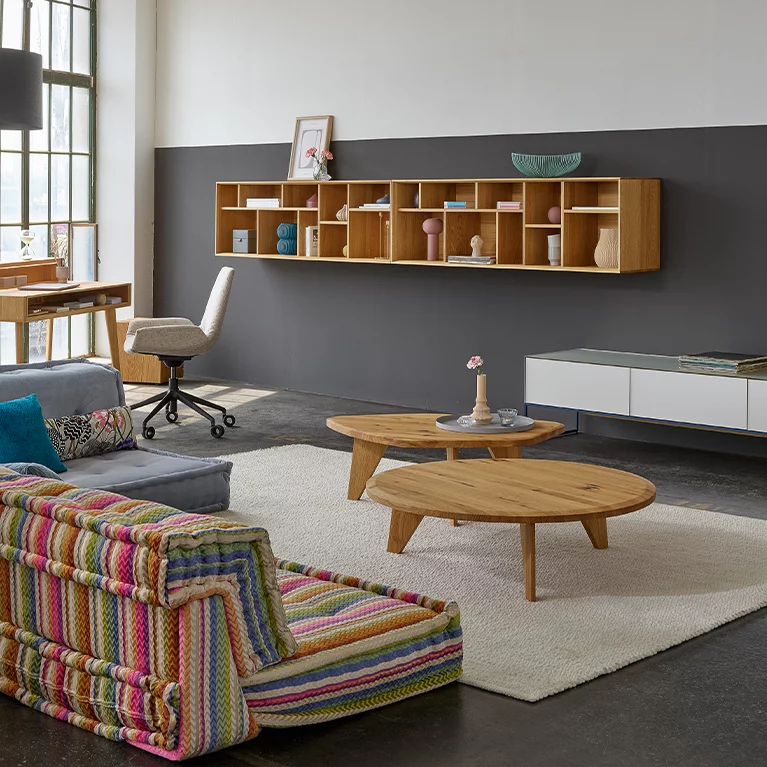 ur coffee tables made of solid wild oak combined with graphic design element and filigno wall unit