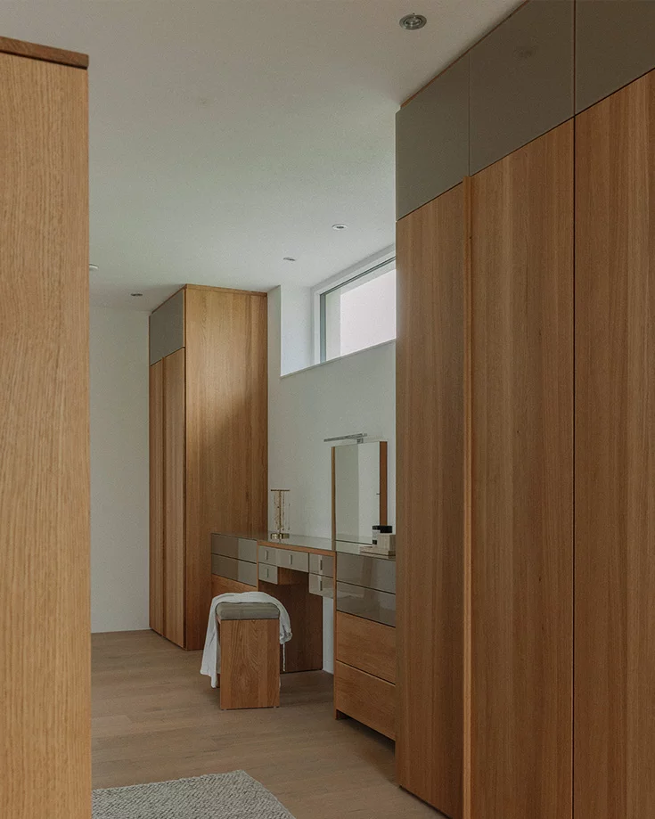 Customised soft wardrobe in solid oak with integrated dressing table