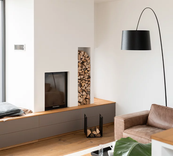 Custom-made storage solution in oak with coloured glass fronts in taupe