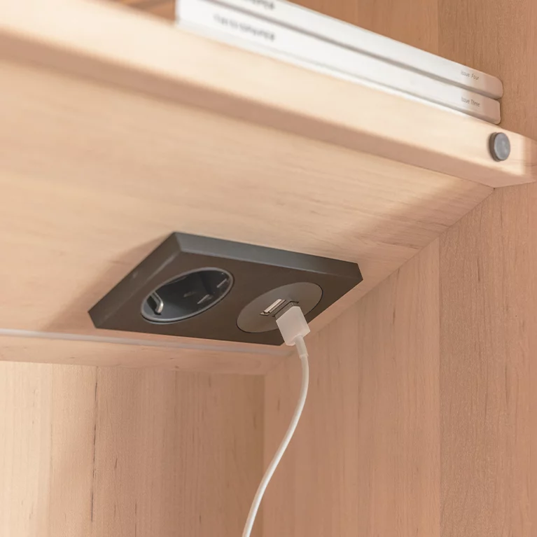 wooden wall module with integrated socket strip, detailed view kids wall module in alder white oil with integrated socket strip, detailed view