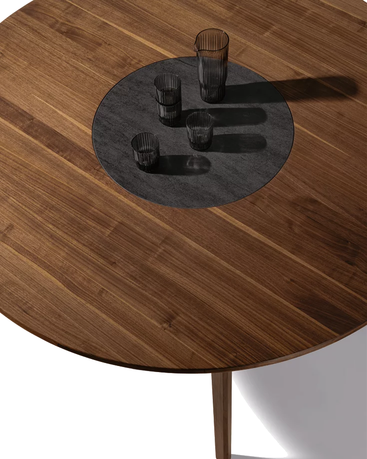 modern miró dining table made of solid wood round in walnut with integrated turntable