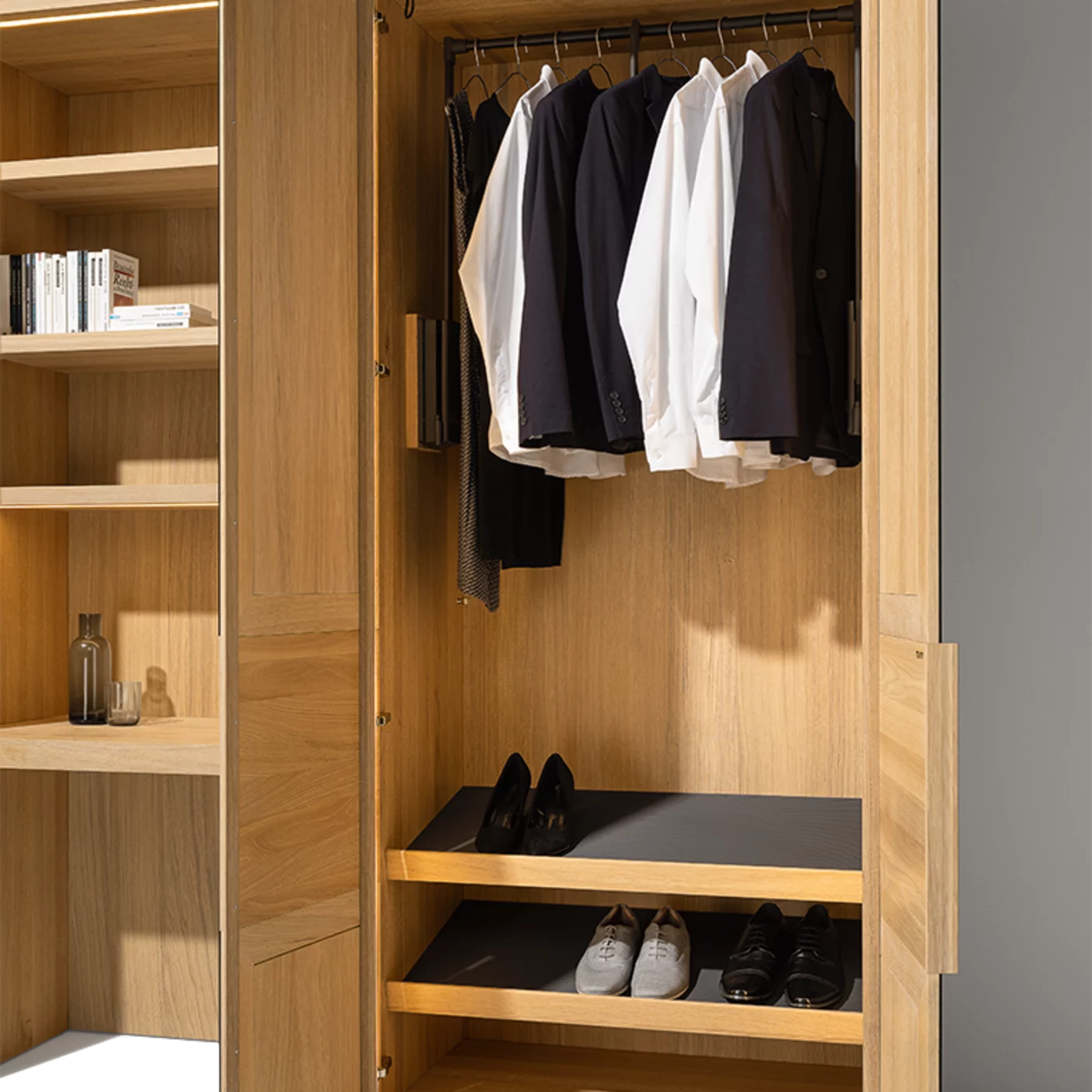 Functional interior with solid wood clothes lift Wardrobe system in oak white oil with functional interior and clothes lift