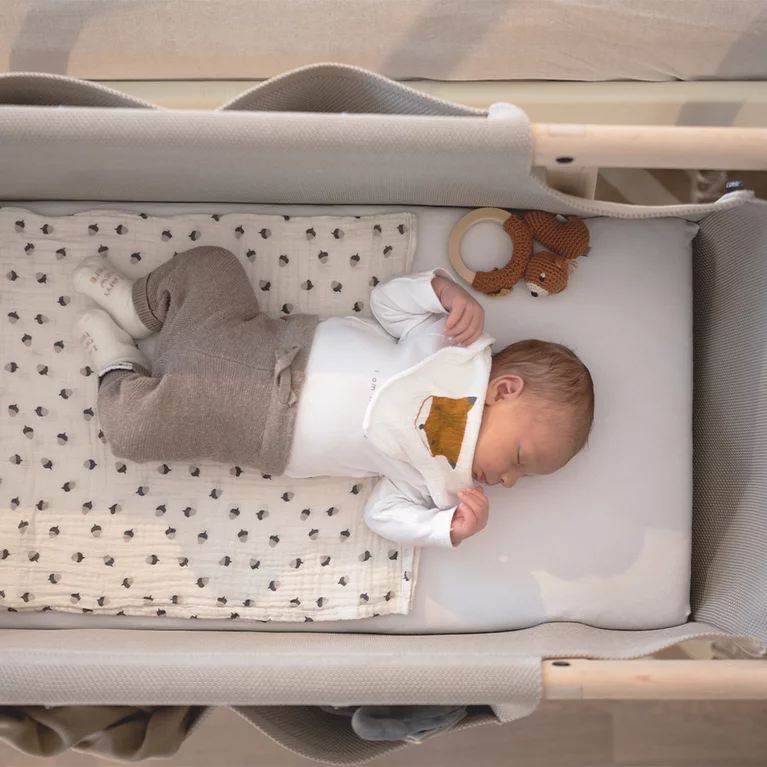 sturdy baby cot made of natural wood with robust knitted fabric sturdy baby cot made of natural wood alder white oil with knitted fabric and practical fabric pockets