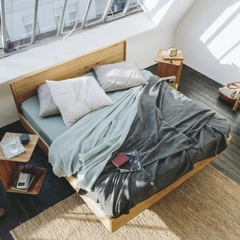 times bed in solid oak wild with clip and sidekick side table and italic clothes ladder in solid oak
