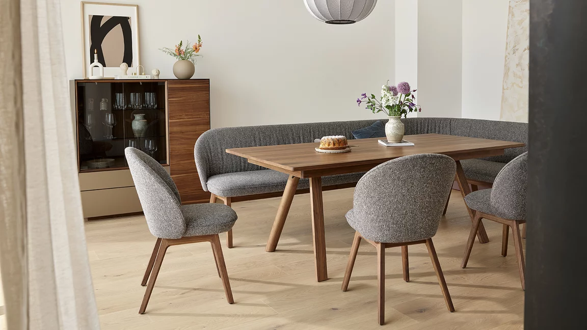 taso extendable wooden table in walnut with flor chairs and the elegant flor bench