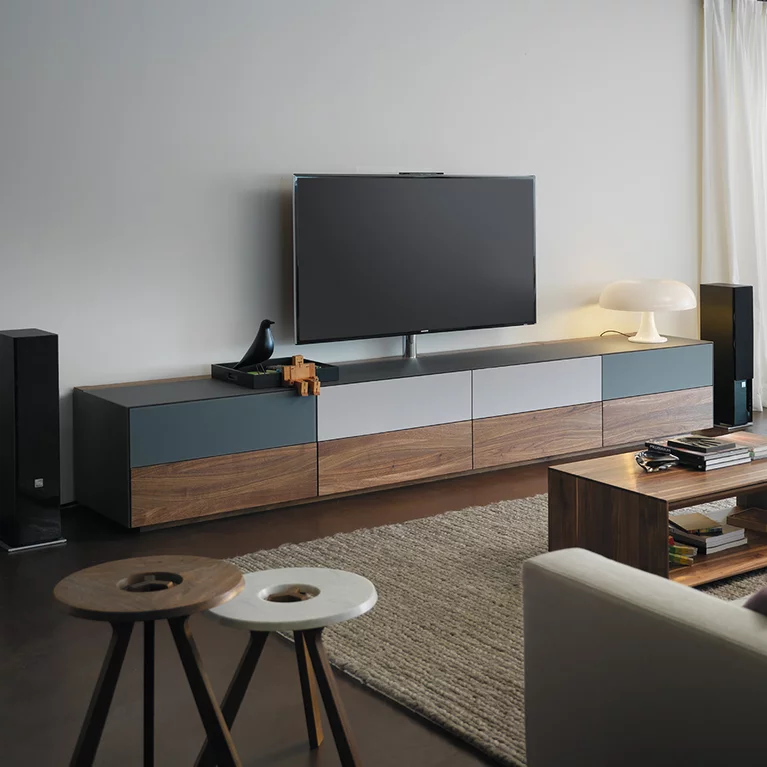 lowboard in solid walnut with coloured glass and fabric fronts