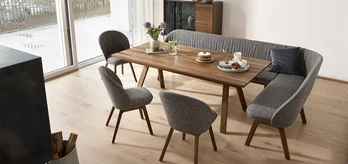 flor dining bench in fabric, flor chairs in fabric and taso dining table in solid walnut wood