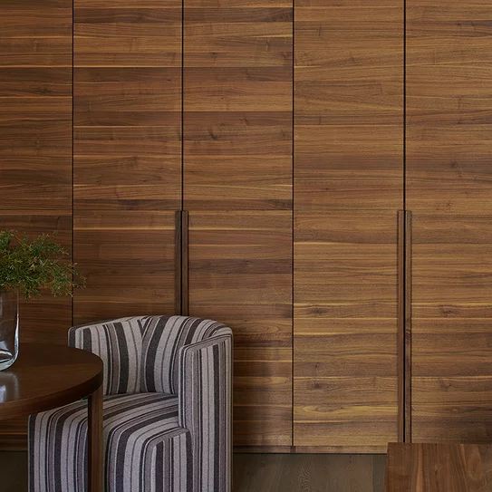 lunetto hinge-door wardrobe with handle strips in solid walnut