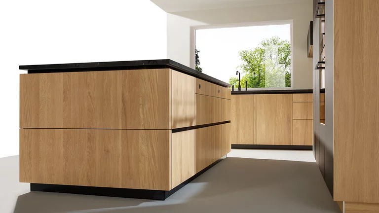 pur real wood kitchen in oak kitchen island with all-round recessed grip and integrated sockets