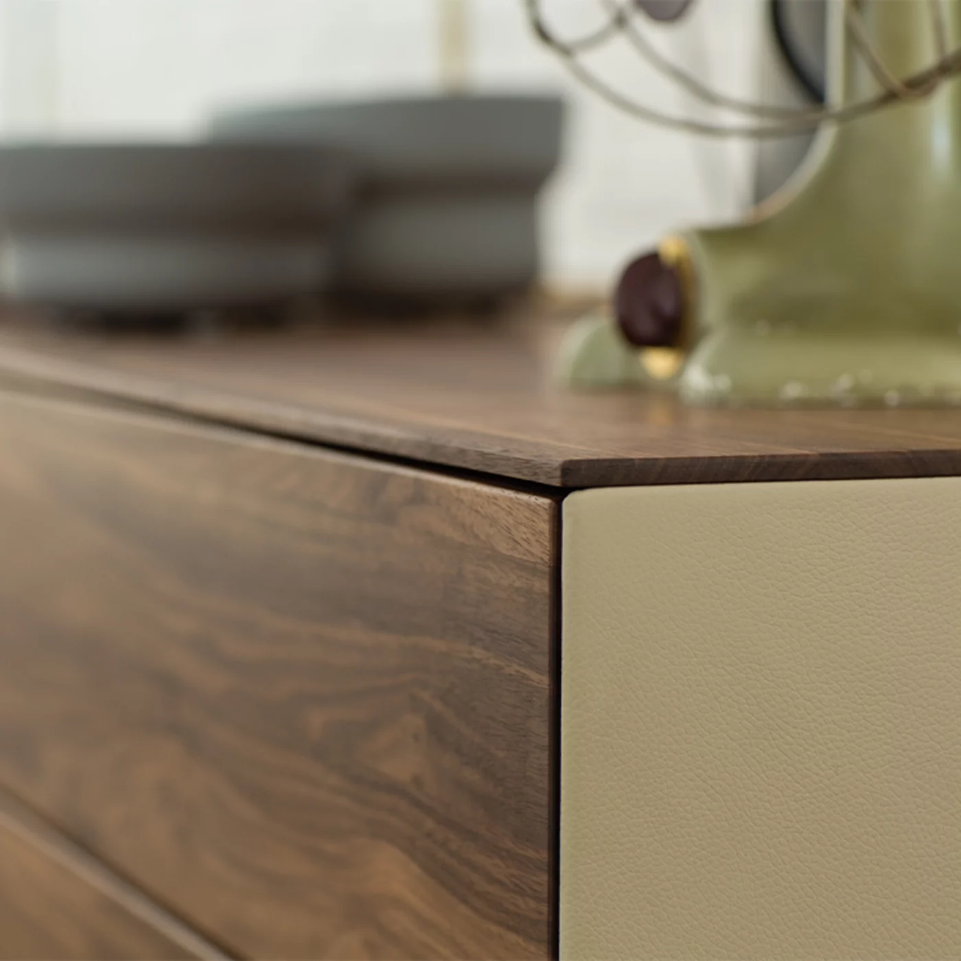 riletto chest of drawers in solid walnut with leather side panel, detailed view