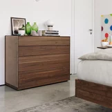 elegant riletto chest of drawers in walnut with leather side panel