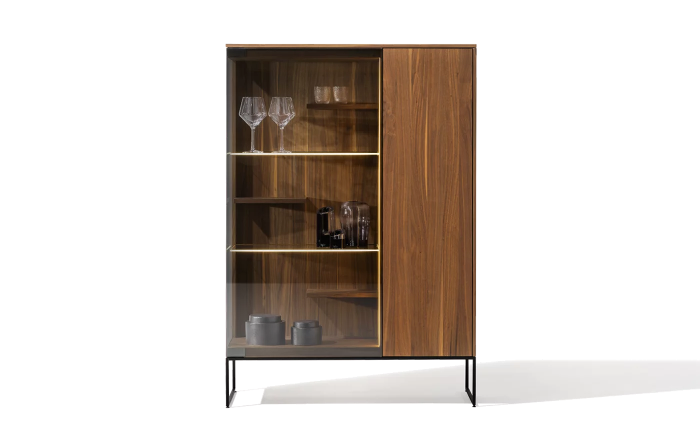 modern filigno highboard made of solid walnut with smoked glass, framed by a black metal frame