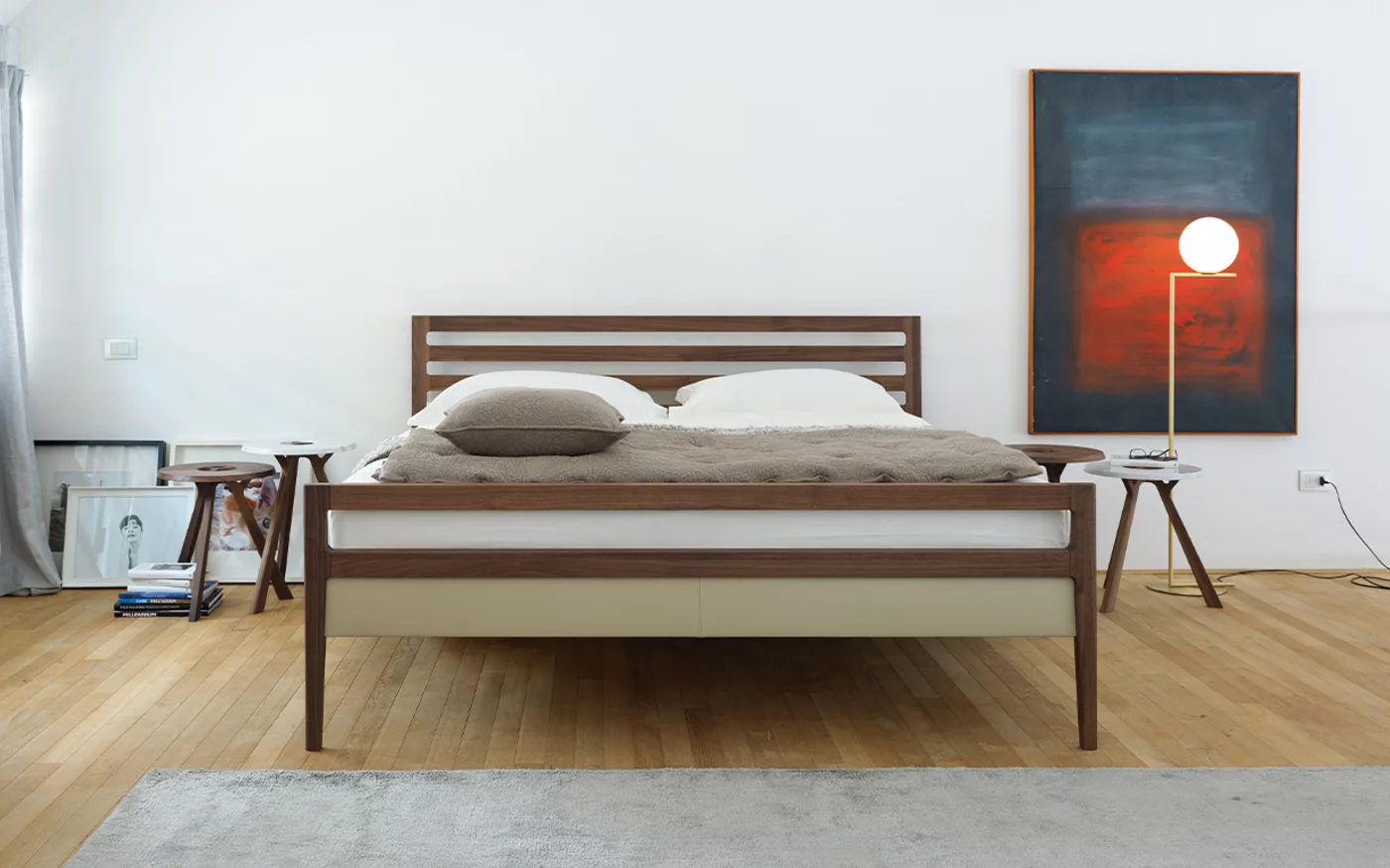 mylon bed in walnut with rungs and bed sides in leather, front view