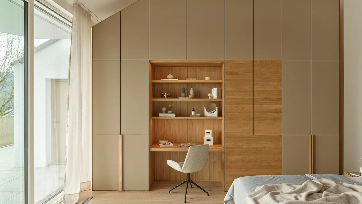 modern wardrobe with intermediate element as a desk made of oak and coloured glass pebble matt matching the lui plus chair