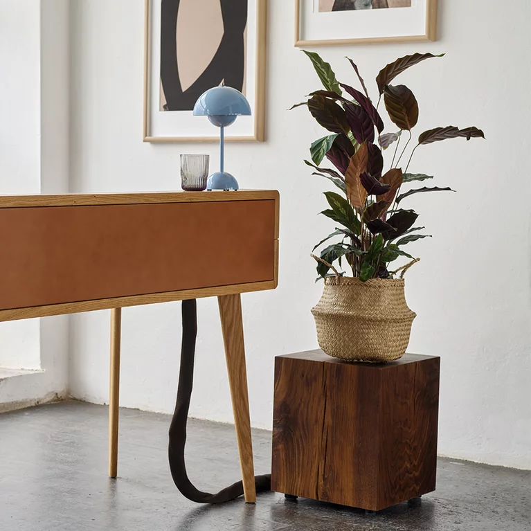smoked oak block side table next to the sol desk with leather and the lui plus office swivel chair