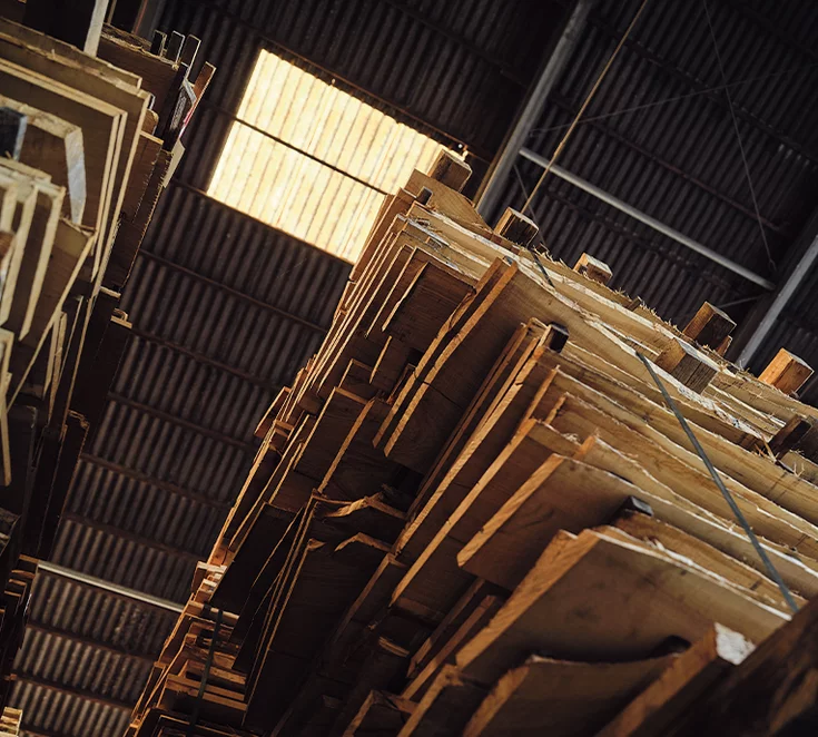 Stacks of solid wood in the huge timber warehouse in Pram