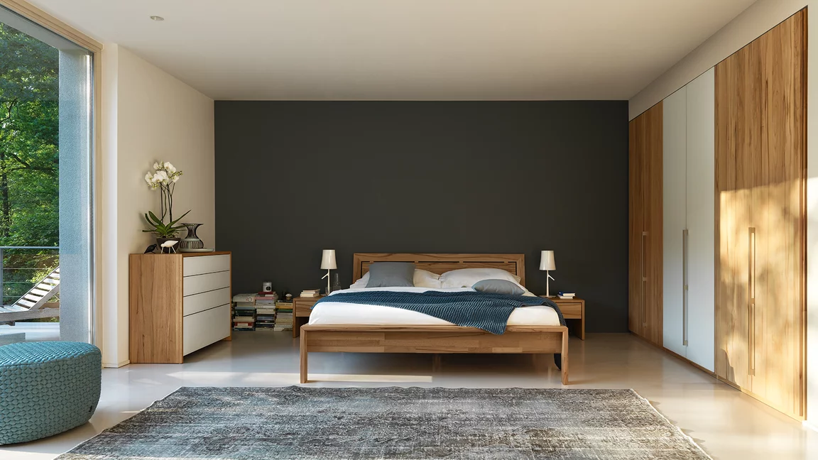 lunetto chest of drawers in beech heartwood with coloured glass fronts to match the lunetto solid wood bed and bedside cabinet