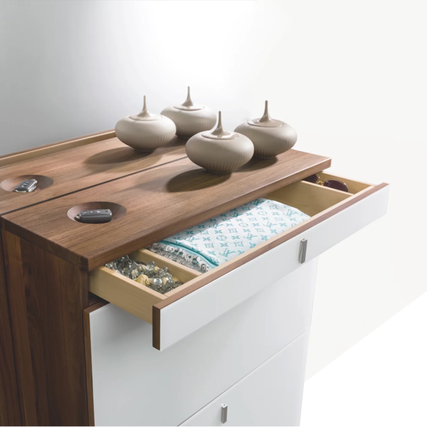 cubus shoe hinged chest of drawers in walnut with coloured glass fronts, hinged handles and key recesses