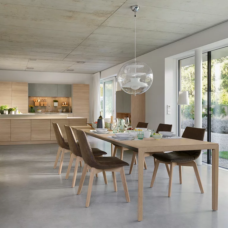 solid wood dining table with wooden base and lui dining chairs