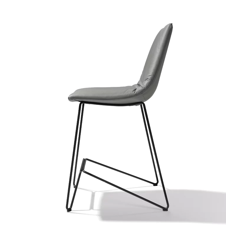 elegant leather bar stool with backrest and elegant black metal frame, side view