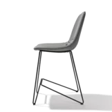 elegant leather bar stool with backrest and elegant black metal frame, side view