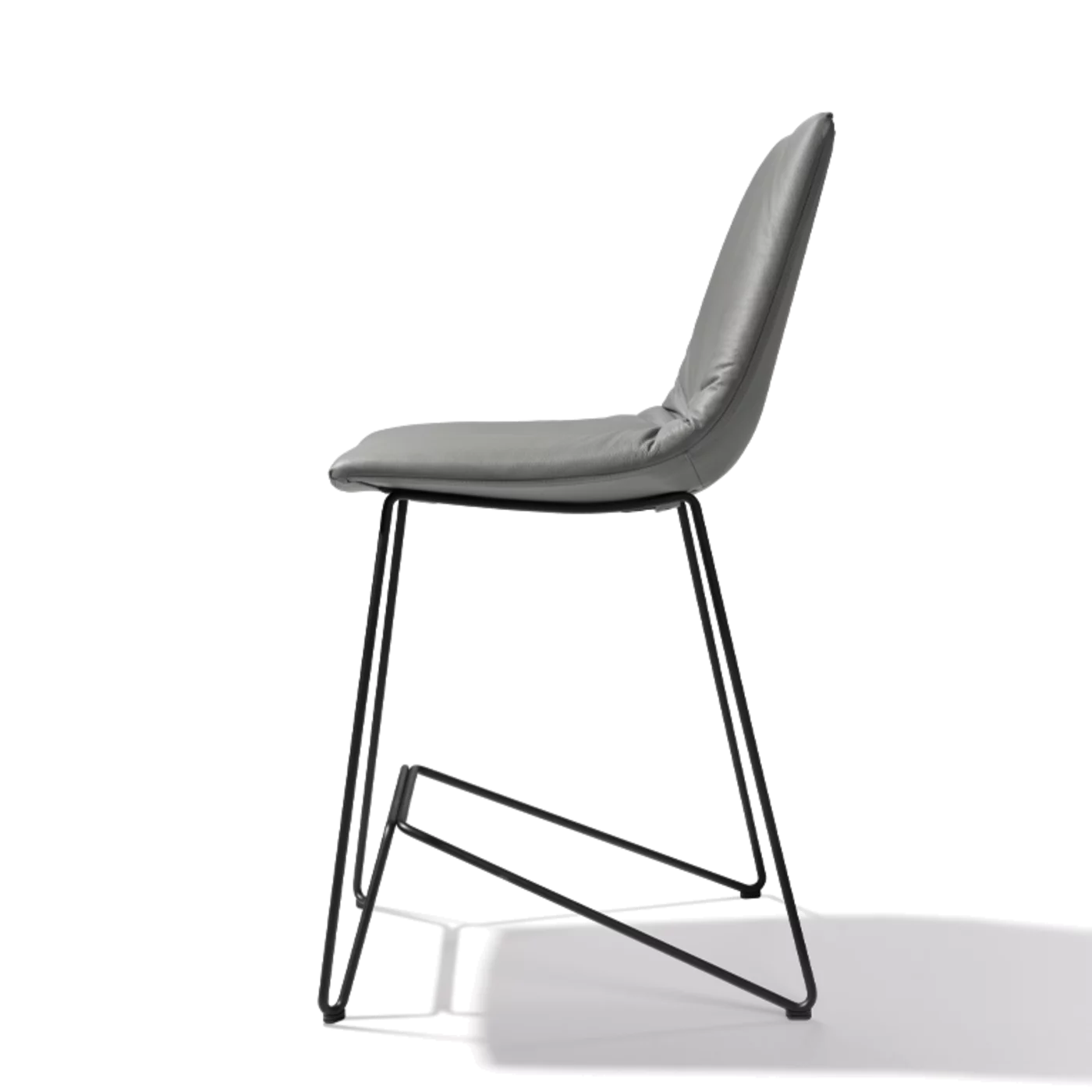 elegant leather bar stool with backrest and elegant black metal frame, side view