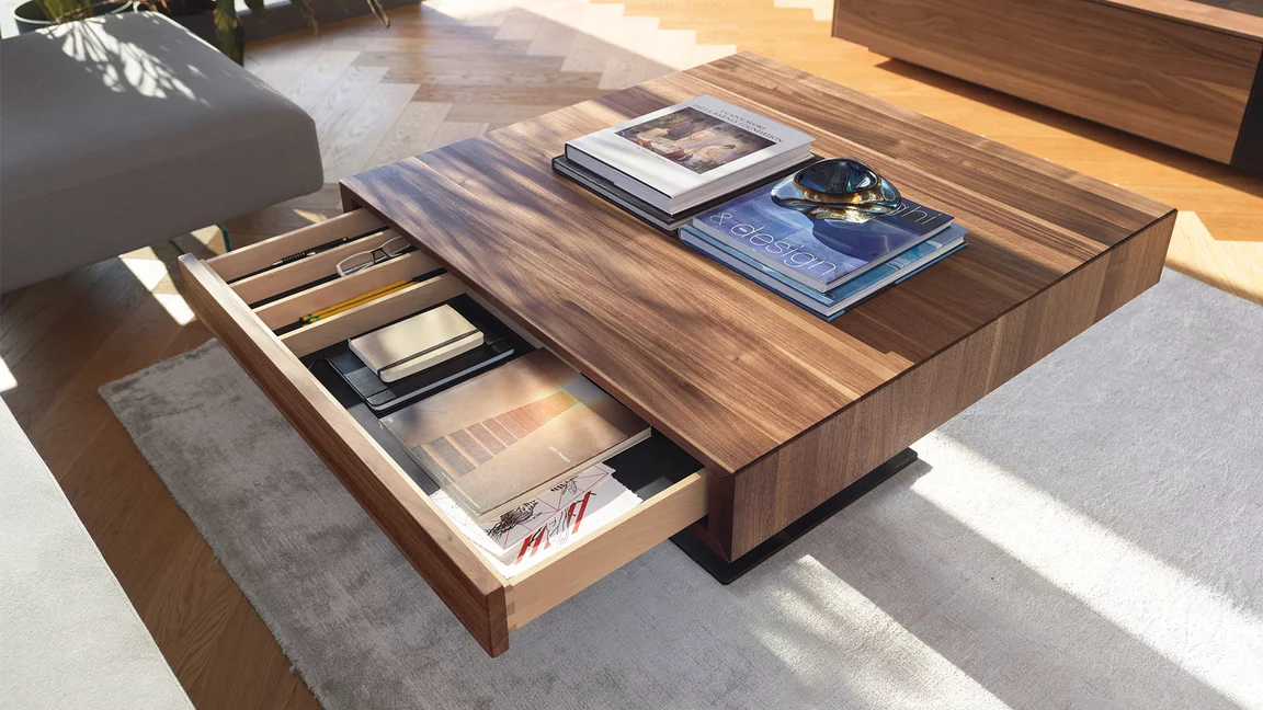 Elegant living room table lift in walnut with open drawer