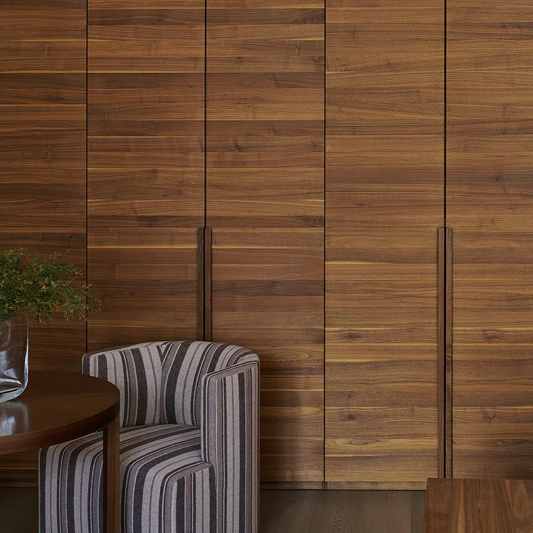 lunetto hinge-door wardrobe with handle strips in solid walnut