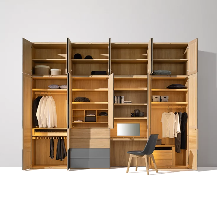 valore hinged door wardrobe illuminated with coloured glass fronts and interior in oak white oil to match the lui chair