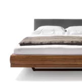 riletto bed in walnut with leather headboard and wooden frame