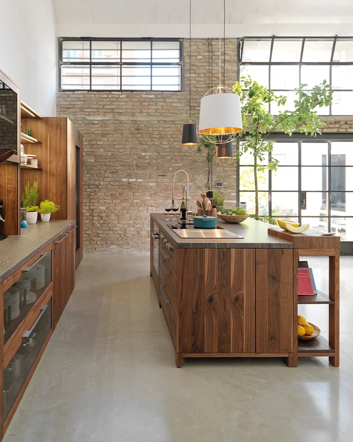 loft kitchen island with wall unit in solid wild walnut and fronts in smoked glass with metal handles in stainless steel finish