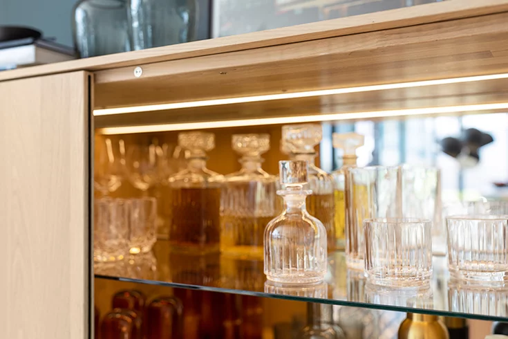 high quality filigno highboard in oak white oil with elegant LED lighting that sets the scene for glassware