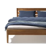 light wooden bed in real walnut